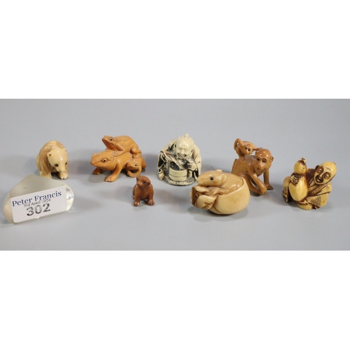 302 - Collection of carved and resin netsukes to include: frogs, monkeys, bear, buddha figurine etc.  (7) ... 