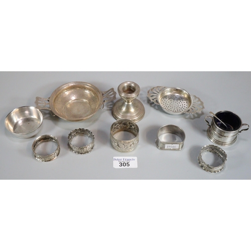 305 - Collection of mainly silver items to include: beaten design Tastvin, various napkin rings, bowl, con... 