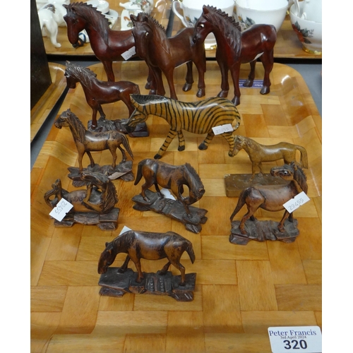 320 - Tray of carved wooden figures of horses and a zebra.
(B.P. 21% + VAT)