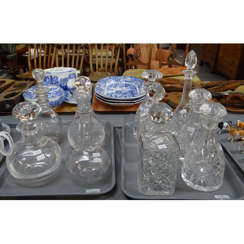 344 - Two trays of glass decanters with stoppers to include: cut glass with star cut bases in various shap... 