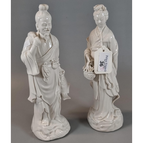 36 - Two Chinese porcelain blanc de chine figures of a fisherman with his net and a maiden carrying a bas... 