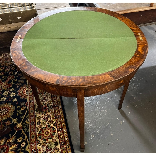 488 - Early 20th century oak demilune folding card table on square tapering legs and spade feet.   (B.P. 2... 