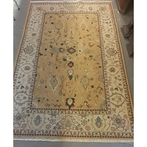 526 - Two similar peach and ivory ground tradition wool area rugs, both decorated with flowers and foliage... 