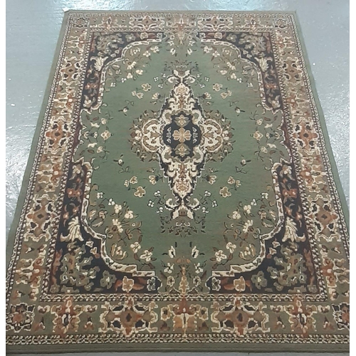 533 - Modern green ground Axminister type floral and foliate carpet with central medallion.  233x170cm app... 