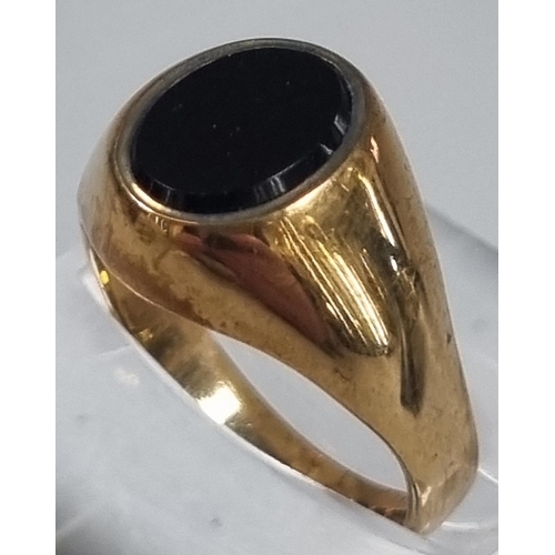 203 - 9ct gold and black hardstone signet ring.  3.2 g approx.  size L.  (B.P. 21% + VAT)