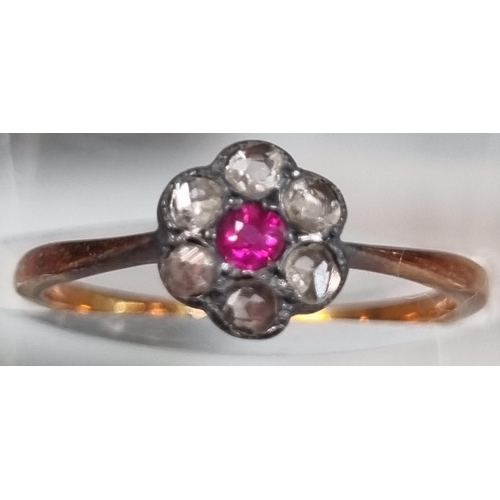 209 - 18ct gold diamond and ruby daisy ring.  2g approx.  Size M1/2.  (B.P. 21% + VAT)