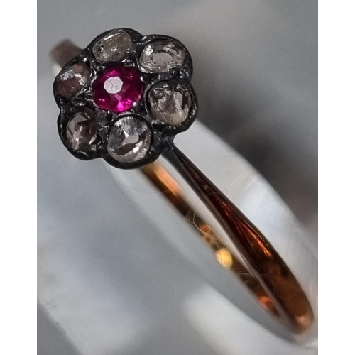 209 - 18ct gold diamond and ruby daisy ring.  2g approx.  Size M1/2.  (B.P. 21% + VAT)