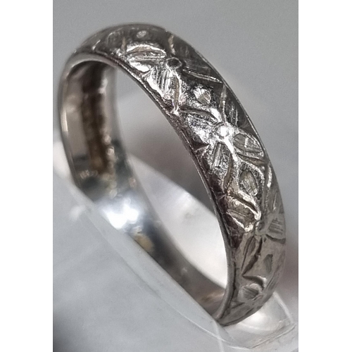 210 - Platinum engraved wedding band.  4.8g approx.  Size L.  (B.P. 21% + VAT)