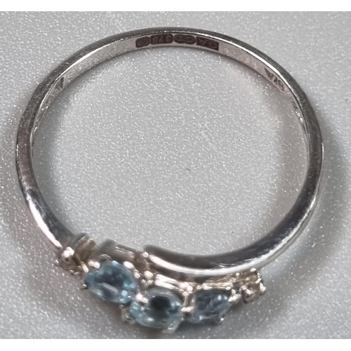 213 - 9ct white gold blue stone twist shank ring.  1.1g approx.  size K1/2.  (B.P. 21% + VAT)