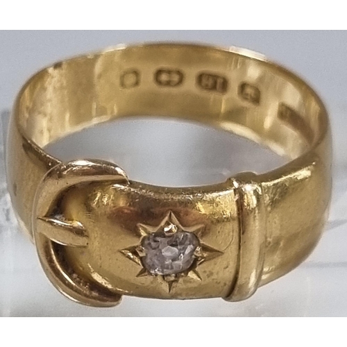 218 - 18ct gold buckle ring with inset diamond chip.  6.4g approx.  Size P1/2.  (B.P. 21% + VAT)