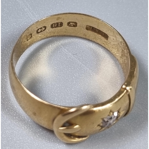 218 - 18ct gold buckle ring with inset diamond chip.  6.4g approx.  Size P1/2.  (B.P. 21% + VAT)