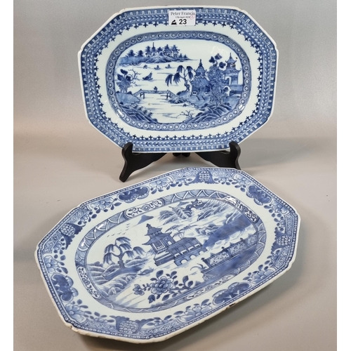 23 - Two similar 18th century Chinese export porcelain blue and white meat platters, both depicting river... 