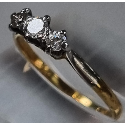 231 - 18ct gold diamond three stone ring.  1.7g approx.  Size N1/2.  (B.P. 21% + VAT)