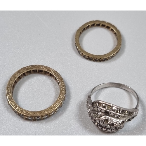 233 - 9ct gold eternity style ring.  1.7g approx. together with another eternity style ring and a marcasit... 