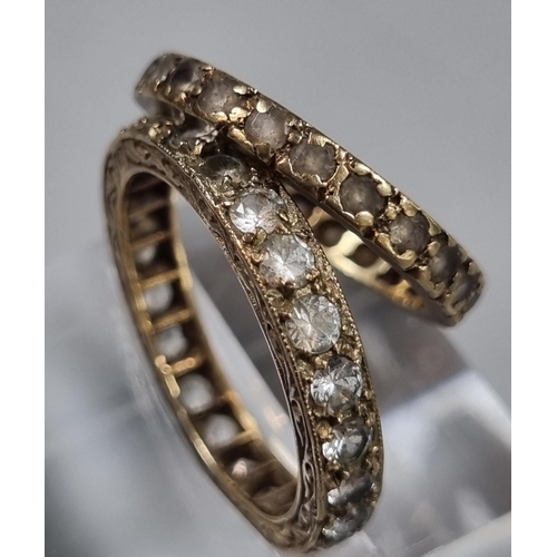 233 - 9ct gold eternity style ring.  1.7g approx. together with another eternity style ring and a marcasit... 