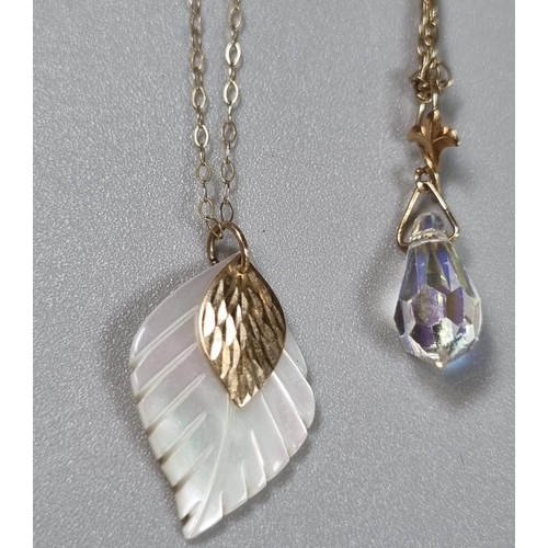 246 - Two 9ct gold fine link chains with mother of pearl leaf design pendant and another glass pendant.  4... 