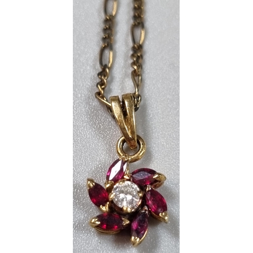 247 - 9ct gold fine link chain with diamond and ruby flowerhead pendant.  4.2g approx.  (B.P. 21% + VAT)