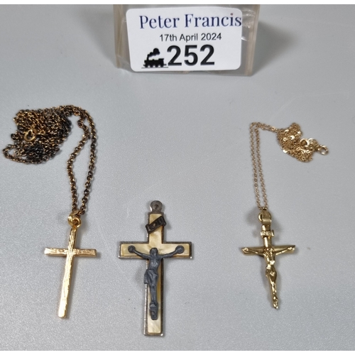 252 - Two 9ct gold chains with crucifix pendants together with another crucifix pendant.  6.4g approx.  (B... 