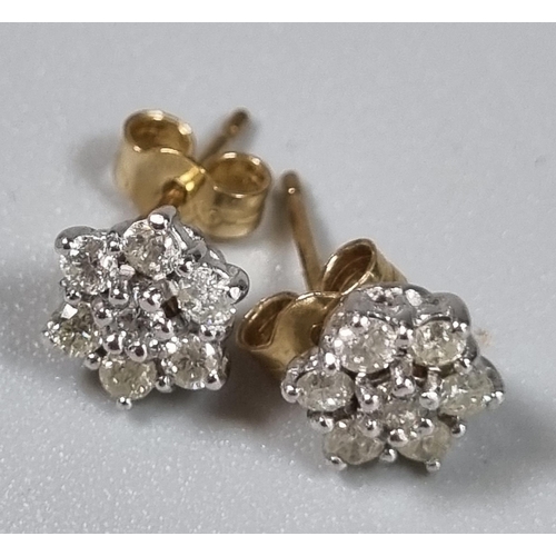 253 - Pair of 9ct gold and diamond flowerhead rings.  (B.P. 21% + VAT)