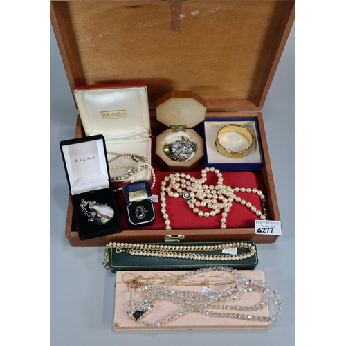 277 - Wooden box containing assorted jewellery to include: dress ring, necklaces, silver charm bracelet an... 