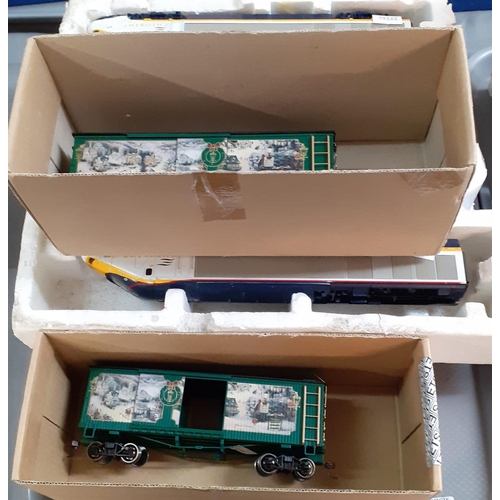 334 - Joeuf OO gauge Eurostar Locomotive and carriages in part box together with Thomas Kinkade's Christma... 