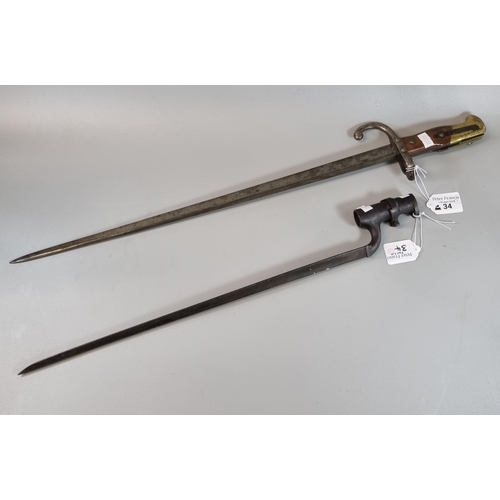 34 - 19th century triangular bladed spike bayonet together with a  19th century French sword bayonet with... 