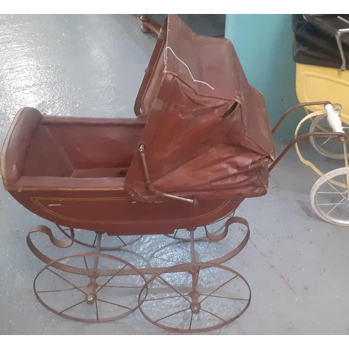 351 - Late Victorian/Edwardian doll's pram with folding canvas canopy, ceramic handle and sprung frame on ... 