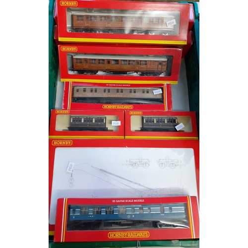 412 - Tray of Hornby Railways OO gauge items in original boxes to include: operating male coach, four whee... 