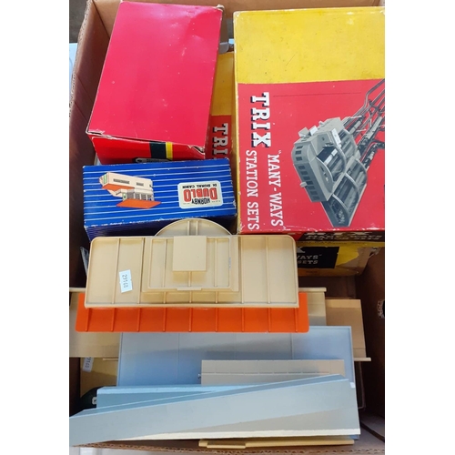 416 - Box of assorted train related items to include: Trix Twin Railway, Many-Ways Station Sets in origina... 