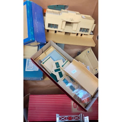 416 - Box of assorted train related items to include: Trix Twin Railway, Many-Ways Station Sets in origina... 