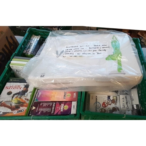 418 - Collection of gaming consoles to include: Nintendo Wii Fit in original box with Wii Fit Pad together... 