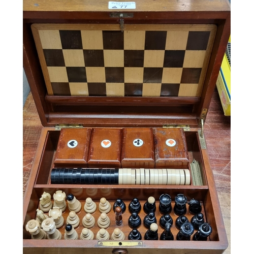 77 - Early 20th century mahogany games compendium, the box containing various chess pieces, card boxes an... 