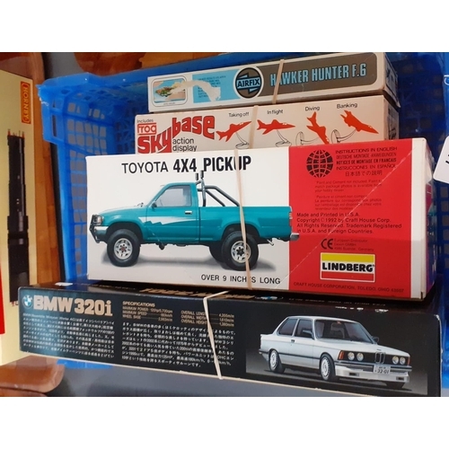 317 - Four boxed model kits to include: Lindberg Toyata 4x4 pickup, BMW 320i two door saloon, Frog 1:72 sc... 