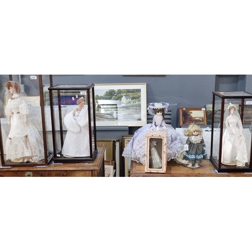 349 - Collection of Franklin Heirloom porcelain dolls, three in perspex and wooden cases together some oth... 