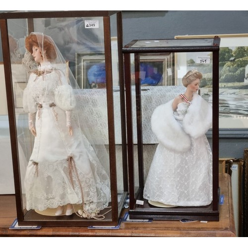 349 - Collection of Franklin Heirloom porcelain dolls, three in perspex and wooden cases together some oth... 