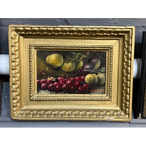 104 - Manner of Oliver Clare (British 1853-1927), still life of fruit on a mossy bank, signed.  Oils on ca... 