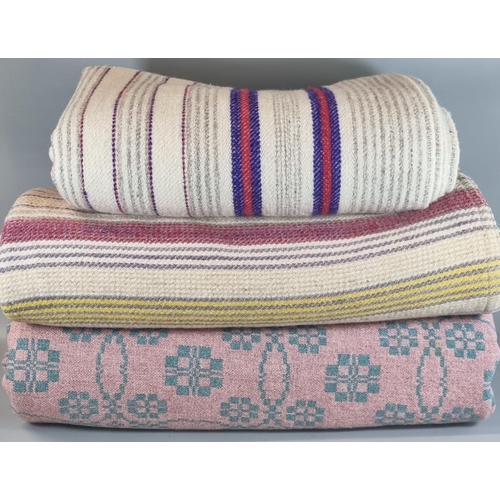 140 - Three vintage woollen blankets or carthen to include: two striped narrow loom and a pink and cream W... 