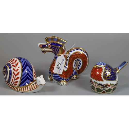 147 - Three Royal Crown Derby English bone china paperweights; 'Robin Nesting' with silver stopper and two... 