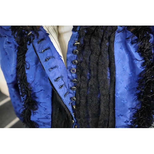 162 - Victorian blue brocade lady's outfit comprising skirt and jacket. (2)
(B.P. 21% + VAT)