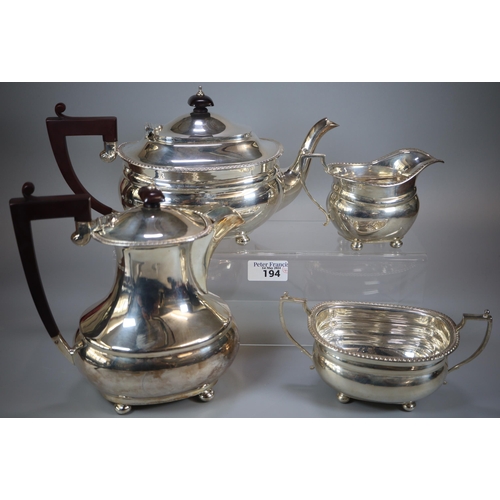 194 - Queen Elizabeth II silver tea service comprising: teapot, two handled sucrier and helmet shaped crea...