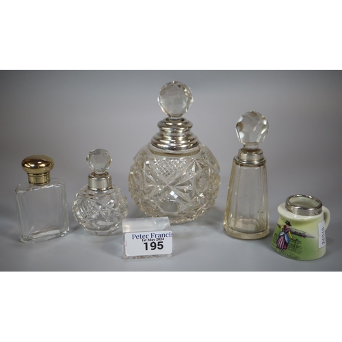 195 - Collection of silver topped and glass scent/cologne bottles, one gilt design together with a contine... 