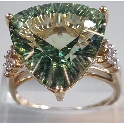 229 - 9ct gold 'Kiwi' green topaz and white sapphire ring.  Sri Lankan origin.  14.275 carat weight.  Size... 