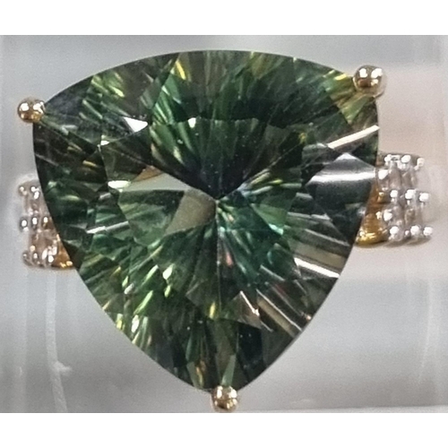 229 - 9ct gold 'Kiwi' green topaz and white sapphire ring.  Sri Lankan origin.  14.275 carat weight.  Size... 