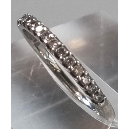 232 - Modern platinum and diamond half eternity ring marked 'Pravins', in Pravins ring box.  1.6g approx. ... 