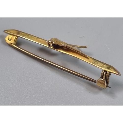 240 - 9ct gold swallow bar brooch.  1g approx.   (B.P. 21% + VAT)