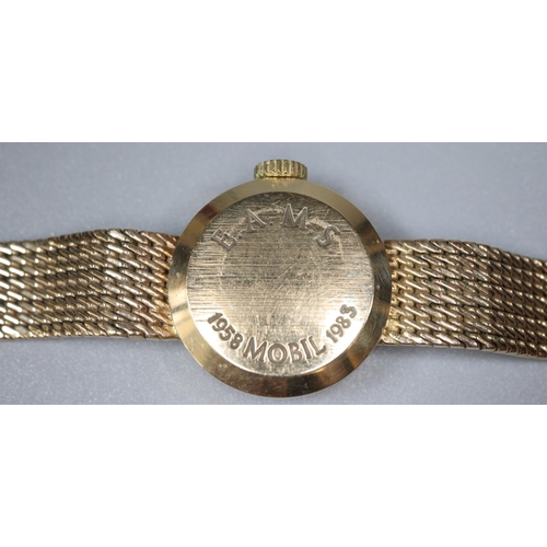 254 - 9ct gold Garrard ladies bracelet watch with satin face, having Baton numerals and integral mesh brac... 