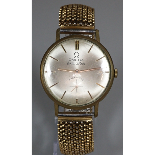 255 - Yellow metal gentleman's wristwatch with satin face having seconds dial on a gold plated expanding m... 