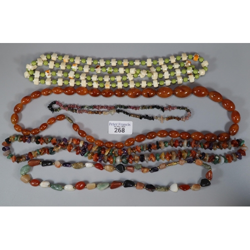 268 - Bag of necklaces to particularly include: an amber coloured necklace.  (B.P. 21% + VAT)