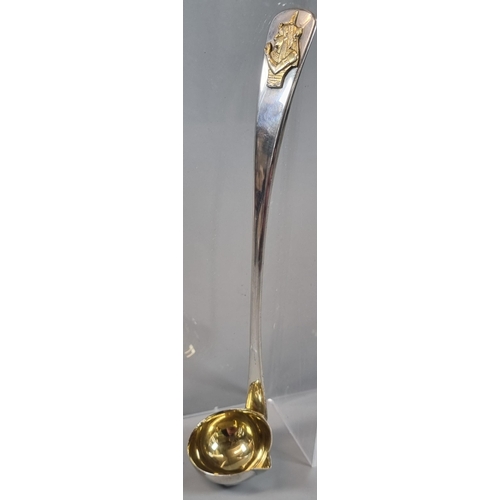 277 - 20th century Toddy ladle with gilded Egyptian portrait  pressed and gilded bowl.  London hallmarks. ... 