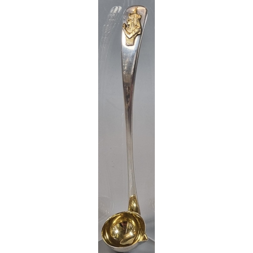 277 - 20th century Toddy ladle with gilded Egyptian portrait  pressed and gilded bowl.  London hallmarks. ... 